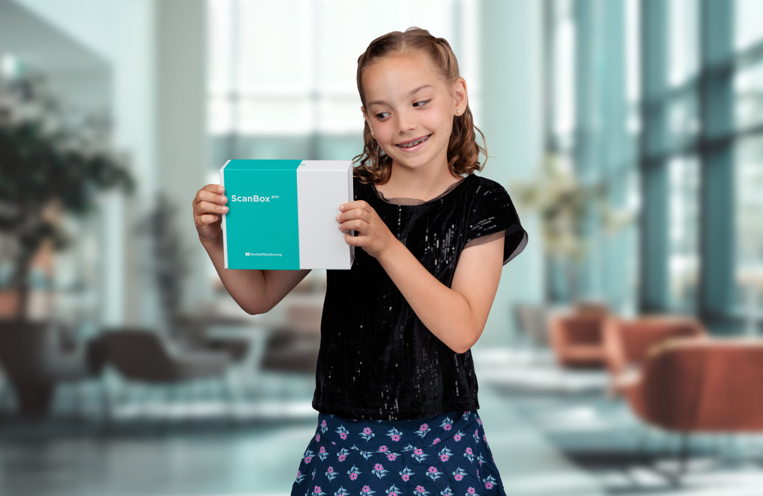 Young patient showing braces smile at Austin Orthodontics