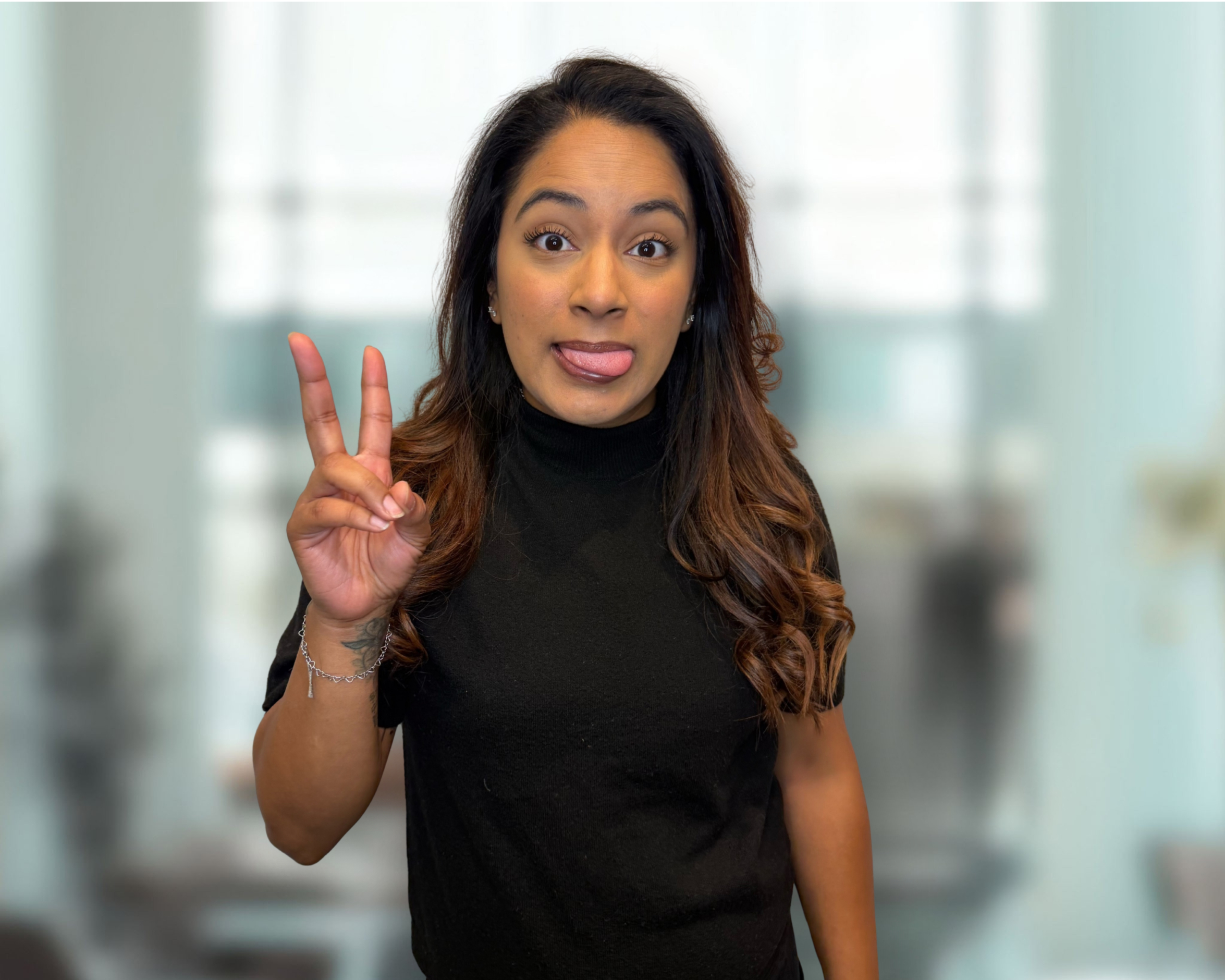 Crystal, Orthodontic Assistant at Austin Orthodontics, playful headshot